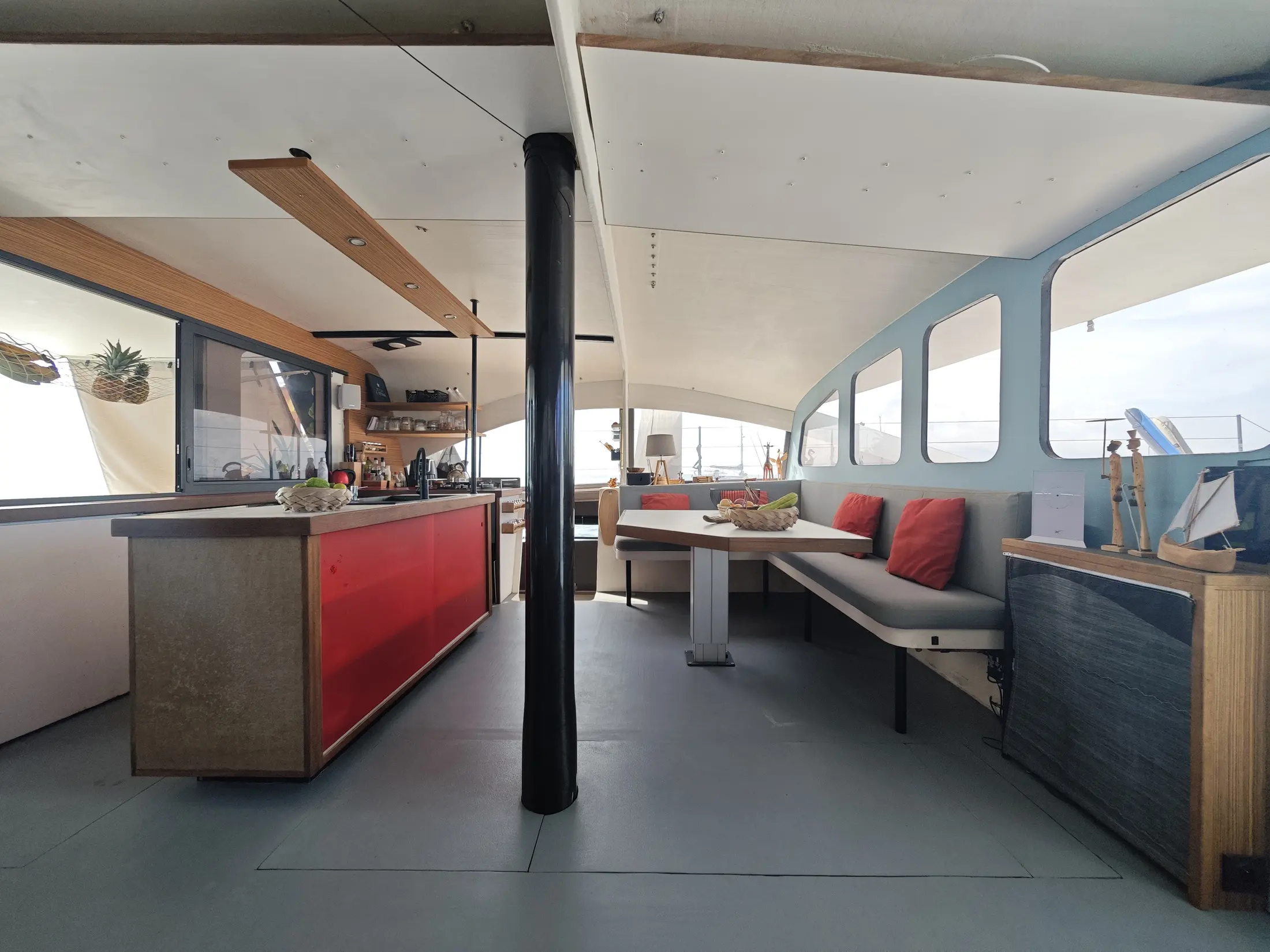 One Cat's saloon and galley open to the lagoon